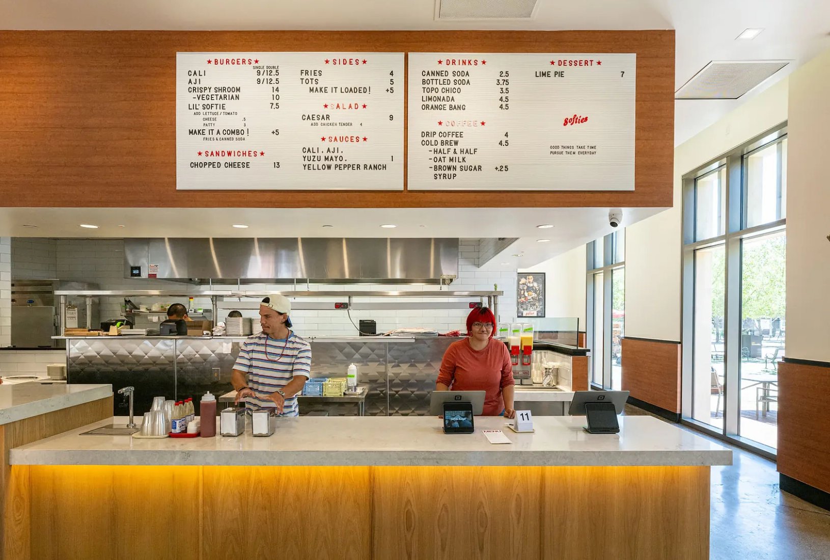 Softies Burger storefront interior showing the service counter and open kitchen